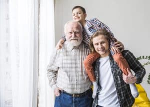 men-different-generations-standing-embracing